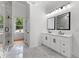 Bright bathroom featuring a double vanity, large mirror and spacious glass shower at 450 Birkdale Dr, Fayetteville, GA 30215