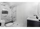 Modern bathroom featuring white and black tile, sleek fixtures, and minimalist design, providing a luxurious feel at 450 Birkdale Dr, Fayetteville, GA 30215
