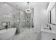 Luxurious bathroom with a modern tub, glass shower, and stylish fixtures at 450 Birkdale Dr, Fayetteville, GA 30215