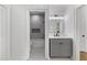 Stylish bathroom featuring a gray vanity and a tub-shower combo with marble-look tile surround at 450 Birkdale Dr, Fayetteville, GA 30215