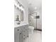 Bright bathroom with a shower, new vanity and mirror at 450 Birkdale Dr, Fayetteville, GA 30215