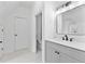 Bathroom featuring a modern sink and mirror, and marble floors at 450 Birkdale Dr, Fayetteville, GA 30215
