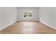 Spacious bedroom featuring hardwood floors, bright white walls and natural light at 450 Birkdale Dr, Fayetteville, GA 30215