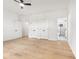 Bedroom featuring a ceiling fan, hardwood floors, and ensuite bathroom at 450 Birkdale Dr, Fayetteville, GA 30215