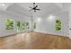 Bright and airy bedroom with tray ceilings, hardwood floors, and backyard views at 450 Birkdale Dr, Fayetteville, GA 30215