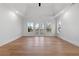 Bright bedroom with hardwood floors and french doors to a balcony at 450 Birkdale Dr, Fayetteville, GA 30215
