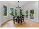 Dining room with floor-to-ceiling windows showcasing natural light and hardwood floors at 450 Birkdale Dr, Fayetteville, GA 30215