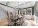 Elegant dining area showcasing a modern chandelier, large window, and stylish decor and furnishings at 450 Birkdale Dr, Fayetteville, GA 30215