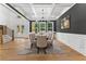 Bright dining room with hardwood floors, coffered ceiling, and a stylish chandelier at 450 Birkdale Dr, Fayetteville, GA 30215