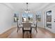 Bright dining area with large windows and stylish light fixture at 450 Birkdale Dr, Fayetteville, GA 30215