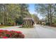 Neighborhood Entrance boasts beautiful landscaping and a guard house at 450 Birkdale Dr, Fayetteville, GA 30215