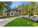 Charming home with a brick and stucco exterior, complemented by a well-manicured lawn and a driveway at 450 Birkdale Dr, Fayetteville, GA 30215