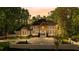 The property features a stunning brick facade, lush landscaping, and a spacious driveway at 450 Birkdale Dr, Fayetteville, GA 30215