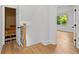 Hallway featuring storage and a view into a bedroom with view to the yard beyond at 450 Birkdale Dr, Fayetteville, GA 30215