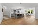 Modern kitchen features a gray island, stainless appliances, and a cozy dining area with backyard views at 450 Birkdale Dr, Fayetteville, GA 30215