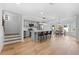Open-concept kitchen and dining area with hardwood floors and natural light at 450 Birkdale Dr, Fayetteville, GA 30215