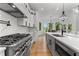 Spacious kitchen featuring a large island, stainless steel appliances, and an expansive range at 450 Birkdale Dr, Fayetteville, GA 30215