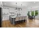 Well-appointed kitchen boasts a center island, stainless steel appliances, and a breakfast nook at 450 Birkdale Dr, Fayetteville, GA 30215