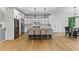 Gourmet kitchen featuring a large island, stainless steel appliances, wine cooler, and breakfast bar seating at 450 Birkdale Dr, Fayetteville, GA 30215