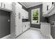 Laundry room with ample storage, gray walls, and a practical sink area at 450 Birkdale Dr, Fayetteville, GA 30215
