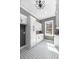 Bright laundry room with white cabinets, gray walls, patterned floors, and a window with a view at 450 Birkdale Dr, Fayetteville, GA 30215