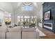 Spacious living room with fireplace, plenty of seating, large windows and high ceilings at 450 Birkdale Dr, Fayetteville, GA 30215