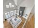 Bright and airy living room featuring a vaulted ceiling, fireplace and an open floorplan at 450 Birkdale Dr, Fayetteville, GA 30215