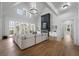 Bright open floorplan living room featuring a fireplace and beautiful hardwood floors at 450 Birkdale Dr, Fayetteville, GA 30215