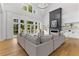 Light-filled living room with soaring ceilings, a fireplace, built-in shelving, and hardwood floors at 450 Birkdale Dr, Fayetteville, GA 30215