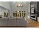 Spacious living room featuring fireplace, hardwood flooring, and large windows at 450 Birkdale Dr, Fayetteville, GA 30215