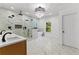 This main bathroom has a luxury shower, free standing tub, marble floors, and a modern chandelier at 450 Birkdale Dr, Fayetteville, GA 30215