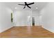 Main bedroom with large windows, a ceiling fan, and ensuite access at 450 Birkdale Dr, Fayetteville, GA 30215