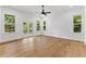 Bright main bedroom with large windows, a ceiling fan, and access to a private balcony at 450 Birkdale Dr, Fayetteville, GA 30215