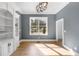 Bright office space featuring built-in bookshelves, a large window, and hardwood floors at 450 Birkdale Dr, Fayetteville, GA 30215