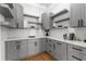 Walk-in pantry features gray cabinetry, white countertops, and floating shelves at 450 Birkdale Dr, Fayetteville, GA 30215