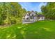 Expansive backyard of a white modern home with dark window trim at 450 Birkdale Dr, Fayetteville, GA 30215