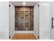 Custom-built wine cellar with wooden racks and accent lighting at 450 Birkdale Dr, Fayetteville, GA 30215