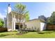Expansive backyard showcases lush lawn and mature trees, offering a serene outdoor space and attractive architectural details at 48 25Th St, Atlanta, GA 30309