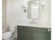 Bathroom featuring a neutral-green vanity and modern fixtures at 48 25Th St, Atlanta, GA 30309