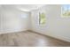 Minimalist bedroom featuring large windows and hardwood floors at 48 25Th St, Atlanta, GA 30309