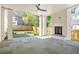 Large covered patio with fireplace and backyard view, perfect for entertaining at 48 25Th St, Atlanta, GA 30309