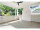 Inviting covered patio features a ceiling fan and stylish stone flooring, perfect for outdoor relaxation and entertaining at 48 25Th St, Atlanta, GA 30309