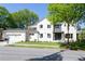 Handsome two-story home with a two-car garage and a white painted brick exterior at 48 25Th St, Atlanta, GA 30309
