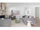 Spacious living room with stone fireplace, gray seating, and open layout for entertaining at 48 25Th St, Atlanta, GA 30309