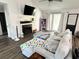 Comfortable living room with a fireplace, built-in shelving, and sliding glass doors at 6060 Carriage Dr, Cumming, GA 30028