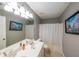 Bathroom including a large mirror, double sink vanity, and a shower with a curtain at 1050 Dunedin Trl, Woodstock, GA 30188