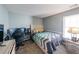 Spare bedroom featuring neutral-colored walls and carpet, as well as a large window for natural light at 1050 Dunedin Trl, Woodstock, GA 30188