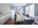 Formal dining room with elegant lighting, a large window, and decorative wall trim at 1050 Dunedin Trl, Woodstock, GA 30188