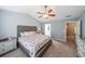 The main bedroom features a ceiling fan, neutral decor, and ensuite bathroom access at 1050 Dunedin Trl, Woodstock, GA 30188