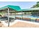 Community picnic pavilion featuring seating areas, a tennis court, and a covered structure at 1050 Dunedin Trl, Woodstock, GA 30188
